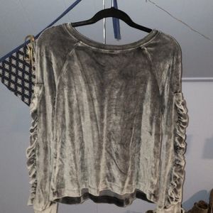 Gray velvet sweater with ruffled sleeves